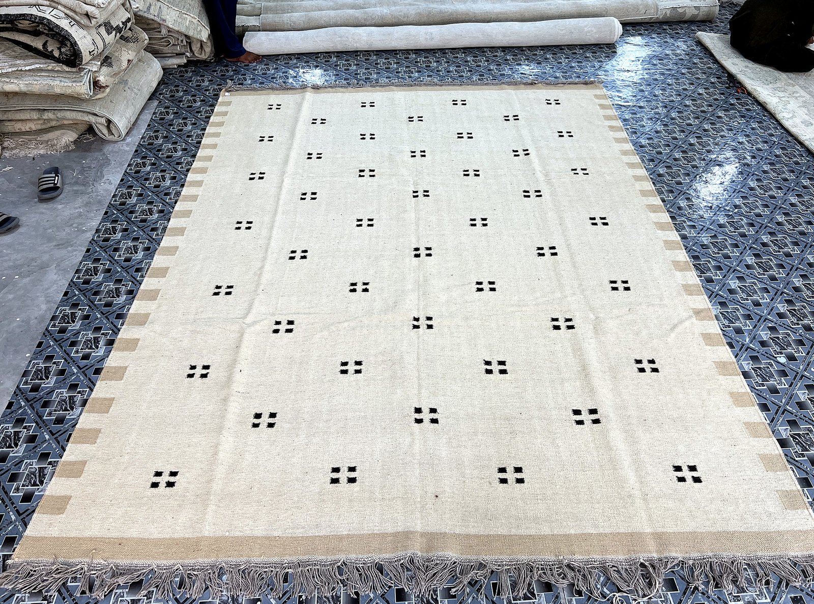 Handwoven ivory kilim rug with scattered black square-dot pattern | The Rugs Curator — Pakistani Premium Rugs