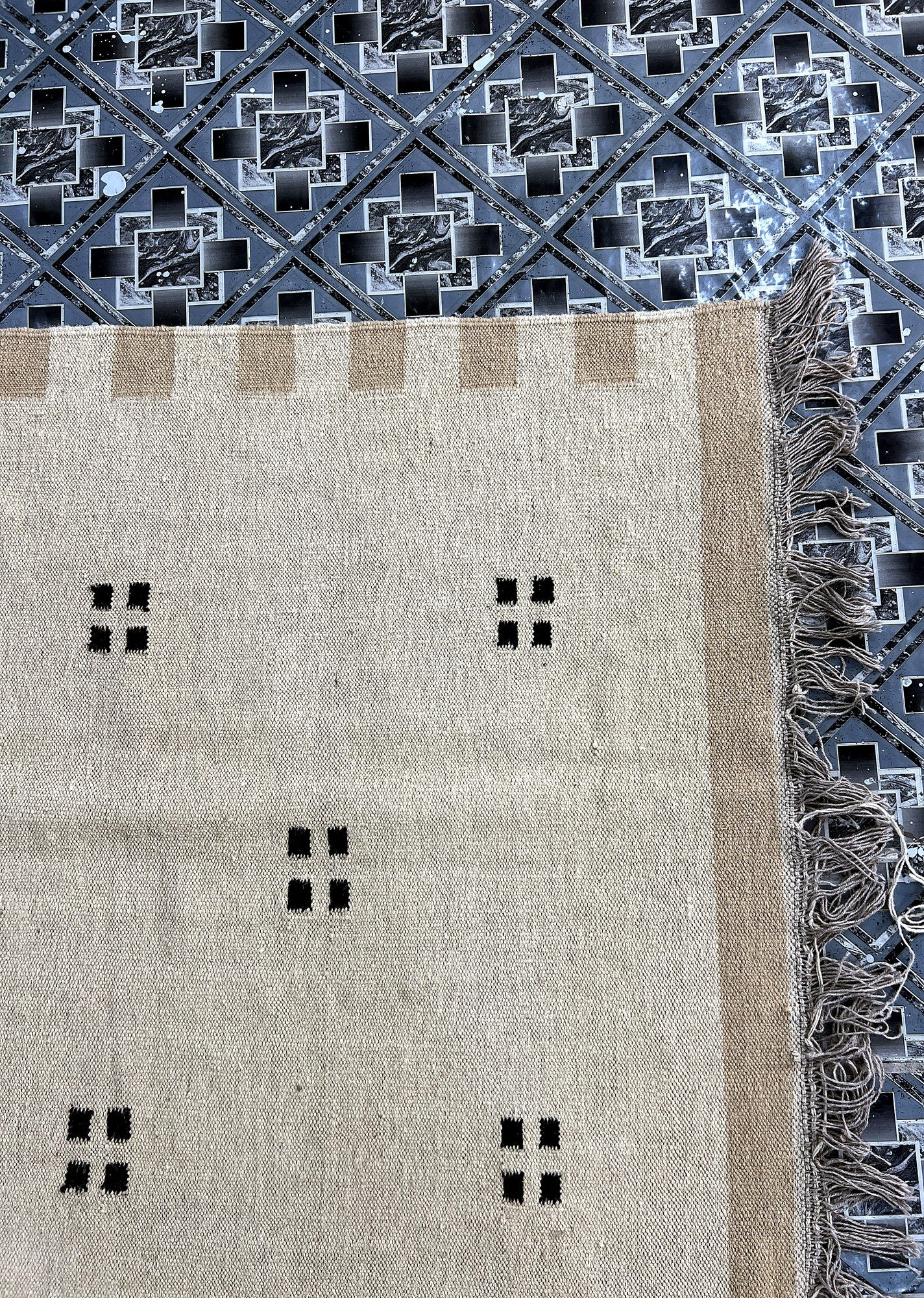 Close-up of the wool-jute weave and fringe on the ivory scatter-dot kilim rug | The Rugs Curator — Pakistani Premium Rugs