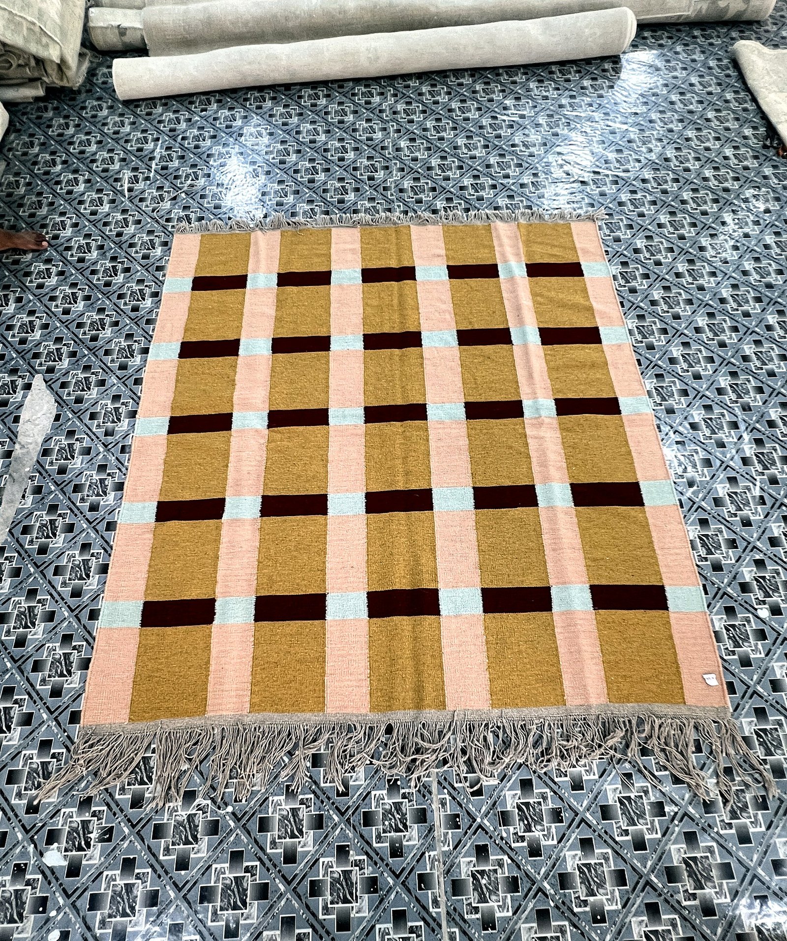 Angled full-length view of the handwoven mustard and beige windowpane check kilim rug | The Rugs Curator — Pakistani Premium Rugs