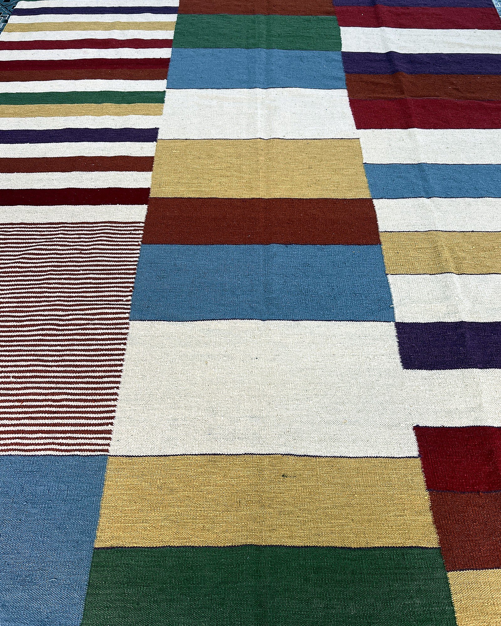 Close-up of the flatweave texture and color blocks on the multicolor prism patchwork kilim rug | The Rugs Curator — Pakistani Premium Rugs
