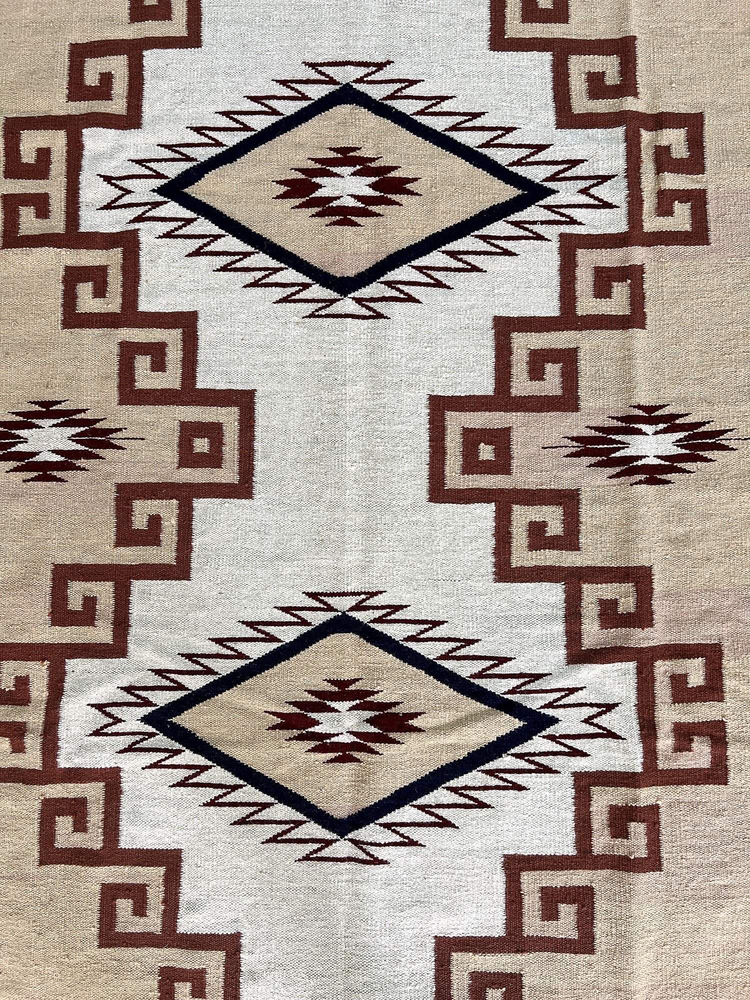 Close-up of the flatweave texture on the ivory diamond medallion kilim rug | The Rugs Curator — Pakistani Premium Rugs